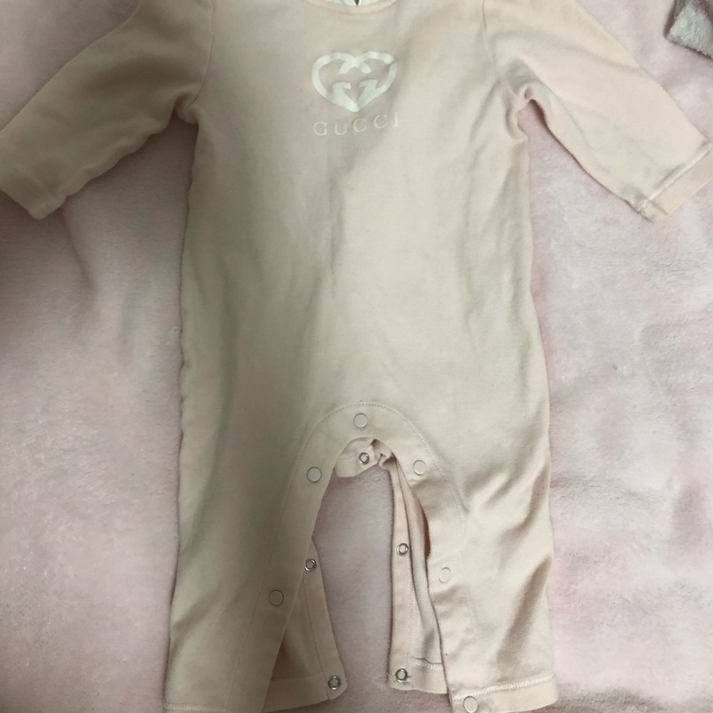 Pink and white Gucci Onesie.
